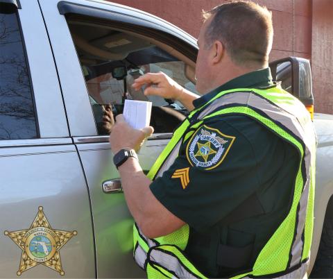 Nassau County Sheriff’s Office Sgt. Bill Quick speaks to a McDonald’s patron at the Hearts and Heroes event.