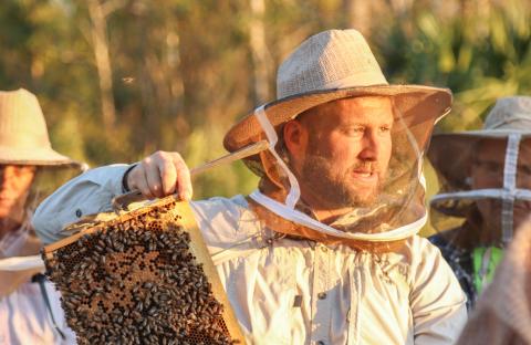 Myron Beachy, president of Nassau County Beekeepers Association, teaches attendees about honeybees at a mentoring session Feb. 27 at the Northeast Florida Fairgrounds. The association focuses on educating the public about honeybees. Photo by Ashley Chandler
