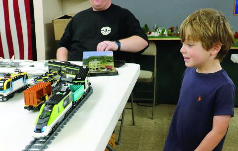 Hunter Tucker, 4, eyes a model train during the 2024 Railroad Day Festival. Plenty of activities await local families at the event Saturday. Visit www.fb.com/wnhsfl.org to learn more.