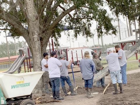 Nassau County Facilities Maintenance staff prepare to spread concrete for a sidewalk at the Stein-Tompkins Sports Complex in Hilliard.