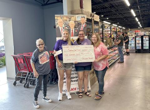 Surviving Your Drive President Sherry Weiscopf and Secretary Mary Lockwood accept a $550 donation from Sherry Taylor and Alice Jones, who represent the Callahan Community Market.