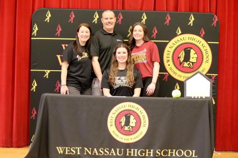 Makenna Cripps, seated, will play softball at Florida Gateway College.