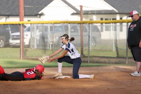 Lady Rambler Ellie Page attempts to tag Hilliard’s Janelle Geoghagan at first base April 10. 
