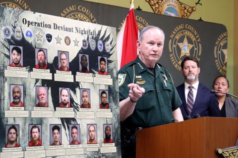 Nassau County Sheriff Bill Leeper points to a board displaying those arrested during Operation Deviant Nightfall. He held a press conference. Photo by Anna Newhoff