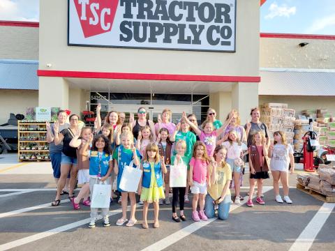 Callahan Girl Scout Troop 63013 donates $900 in food and toys to Nassau County Animal Services.