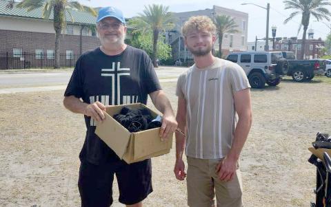Joel Pace and Luke Surrency deliver supplies to homeless individuals in Jacksonville April 26. Be the Change Northeast Florida needs donations of pop-top food, toothpaste, toothbrushes, nail clippers, combs, snacks, hotel size soap, washcloths and backpacks. Donations may be dropped off at the Nassau County Record.