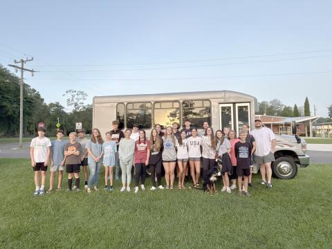 Youth from First Baptist Church Hilliard prepare to board the bus for Camp Clarity Monday. 