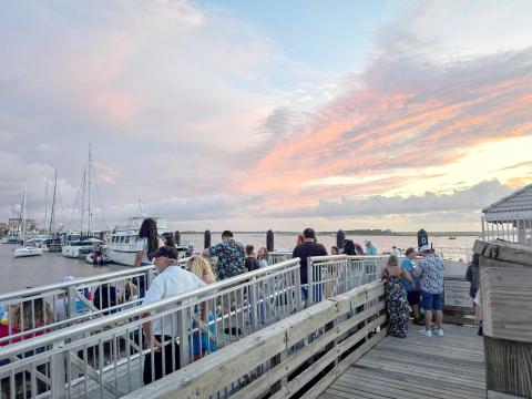 The gangway that collapsed during the Hometown Fourth of July Friday night event is pictured at top, full of spectators less than an hour before the collapse, pictured above. Photos by Ashley Chandler