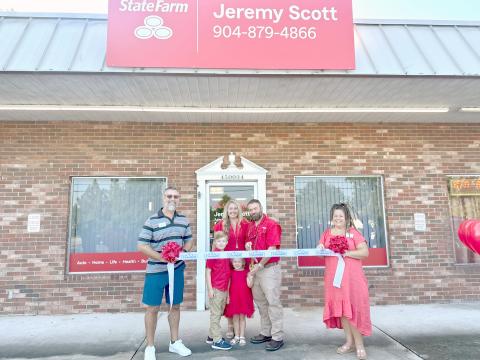 Jeremy Scott is joined by family and Nassau County Chamber of Commerce members as he celebrates the grand opening.