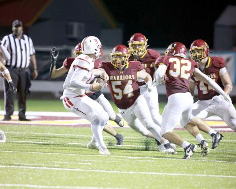 Friday night the Warriors defeat the Trojans 70-30.
