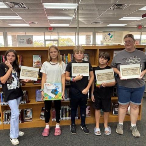Numerous prizes are collected at the end of the Nassau County Public Library’s “Color Our World” summer reading program.