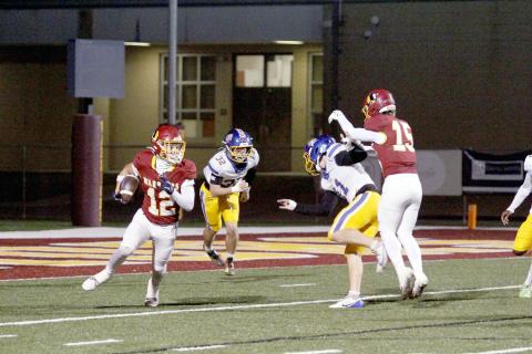 Sophomore defensive back Josh Stafford takes possession of the ball at left. 