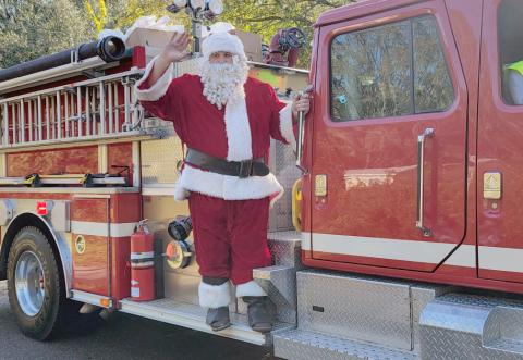 Santa rides on a Hilliard fire truck in 2024 and will climb aboard again this Saturday. Photo by Amanda Bishop