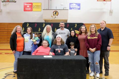 West Nassau High School senior Brian Wheat signs with Mercer University Dec. 3, with friends and family attending the celebration.