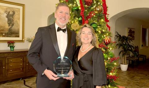 Judge Steve Fahlgren displays his Jurist of the Year award. It was presented by the Jacksonville Chapter of the American Board of Trial Advocates.