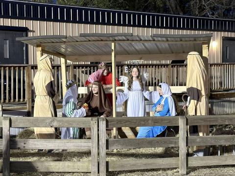 Sonshine Christian Academy families and members of the Crossroads Church congregation partake in a walk-through “Journey to Bethlehem” in Callahan Friday.