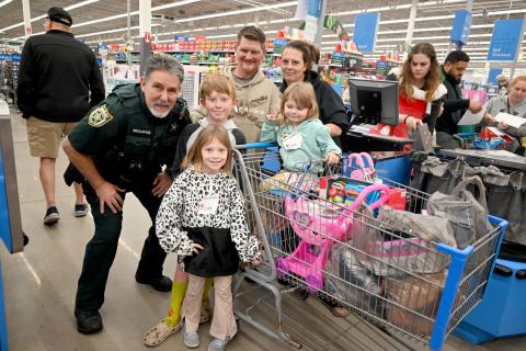 Students from Bryceville Elementary School, Call-ahan Elementary School, and Callahan Intermediate School shop with deputies from the Nassau County Sheriff’s Office Dec. 4 during the annual Shop with a Cop event.