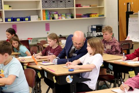 Florida Teacher of the Year Mark Harrison participates in a math lesson in teacher Alexis Neu’s fourth-grade class Thursday afternoon. He concluded the day by helping students enter vehicles to head home. Photos by Amanda Bishop
