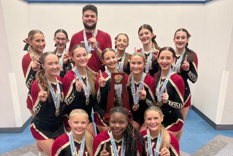 The West Nassau High School cheerleaders celebrate the school’s 15th state championship Jan. 23. The team competes against five other teams within Florida High School Athletic Association Class 1A Medium Non-Tumbling.