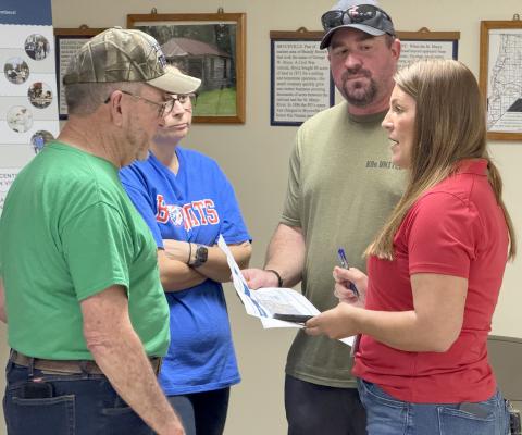 Board of Nassau County Commissioners Chair Alyson McCullough speaks with Bryceville resident Rocky Lynn and other concerned  citizens during a community information session Friday at the Bryceville Community Center. Submitted
