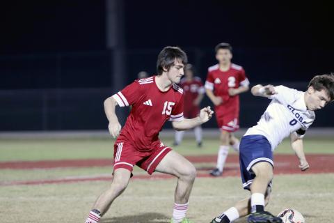 Clayton Floyd tries to get the ball from a Kodiak.