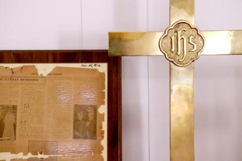 Callahan Methodist Church celebrates its 140th anniversary with a display of artifacts and pictures. A cross was placed by a 1912 newspaper clipping, showing the historical significance of the church through the years. Photo by Anna Newhoff