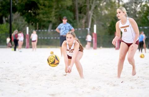 The beach volleyball team is ready for action.