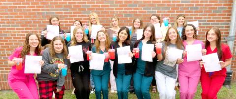 Hilliard Middle-Senior High CNA students celebrate a 100% pass rate.