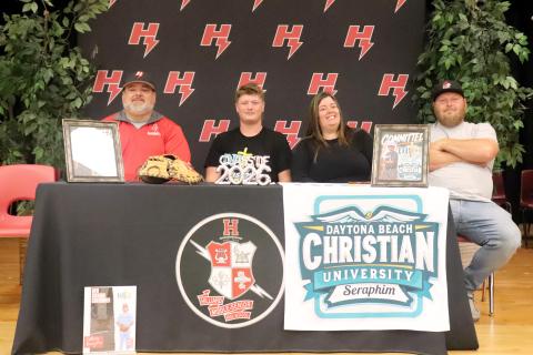 Hilliard Middle-Senior High School senior Anthony “Bubba” Musgrove is joined by mom Heather Weinberg, Corey Stone, and Coach Larry West as he signs with Daytona Beach Christian University April 28. Musgrove is a member of the Hilliard varsity baseball team and will continue to play at DBCU. Photo by Anna Newhoff
