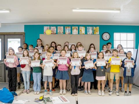 Sonshine Christian Academy third through 12th grade students display certificates from their performances at the League of Christian Schools’ Arts Festival held in Lakeland. 