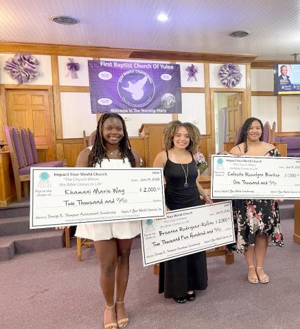 Khamani Way, Breanna Rodriguez-Rollins and Celeste Barket receive their scholarships.