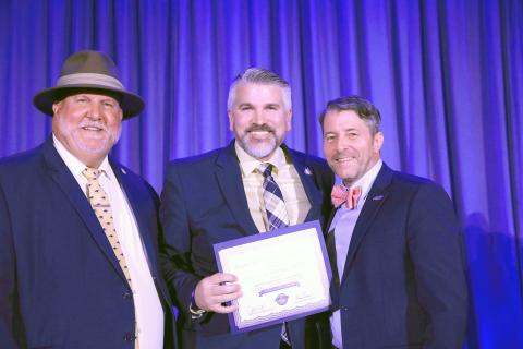 Nassau County Clerk of the Circuit Court and Comptroller Mitch Keiter, center, receives his certificate of completion. Submitted