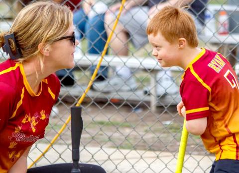 Coach Julia Brown encourages Ryan at the plate. The Callahan Challengers are expanding to include a soccer team. Photo courtesy of the Callahan Challengers League