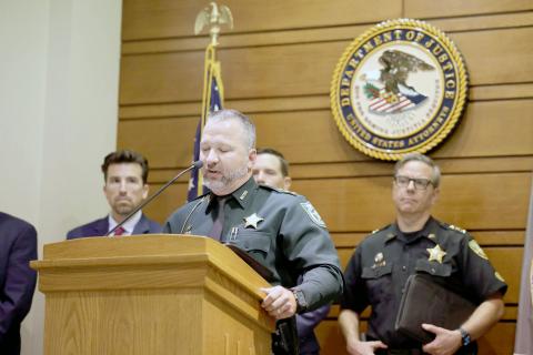 Nassau County Sheriff’s Office Undersheriff Jon Hooper addresses 13 alleged gang members arrested at a Department of Justice press conference in Jacksonville. Submitted