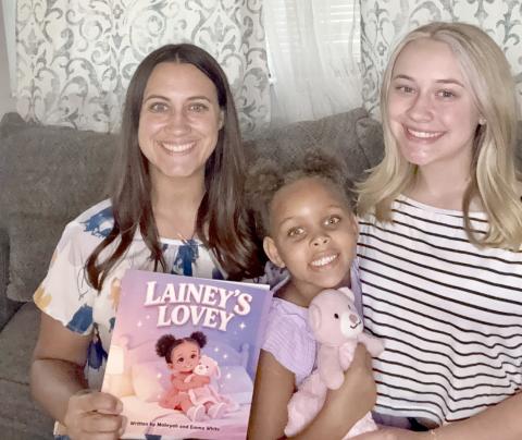 Mahryah, Lainey, and Emma White pose with “Lainey’s Lovey” and the lovey that comforts Lainey, now 6. She was the inspiration for the book about children in foster care. Submitted