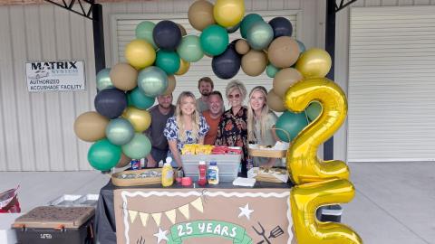 Neal and Marty Cochrane and family celebrate Cochrane Collision Center’s 25th anniversary Thursday. They offered hot dogs and treats to everyone who stopped by. The business specializes in repairing wrecked vehicles and is located at 617473 Brandies Ave., Callahan. Photo by Amanda Bishop