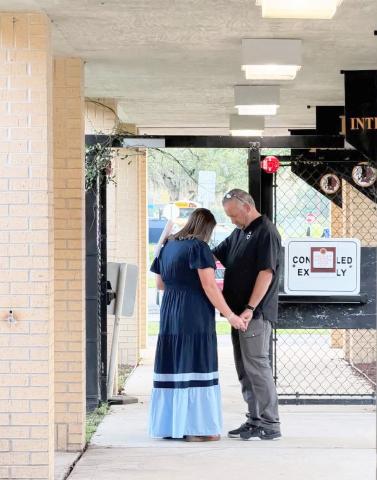 West Nassau Principal Melissa Johnson joins in to pray over West Nassau High School, students, and staff. Submitted