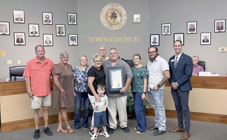 Hilliard Mayor John Beasley is joined by his family, including wife Donna, and Florida League of Cities Director of Member Services and Training Chris Holley Thursday night. Beasley has spent 25 years as a public servant, first elected Nov. 7, 2000. He currently acts as mayor of the town. Photo by Alicia Head