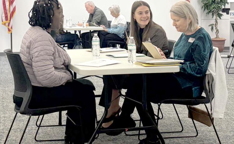 Chloe Clay works with other interviewers to help select the next class of Take Stock in Children Nassau scholars. A total of 37 students were chosen. Submitted