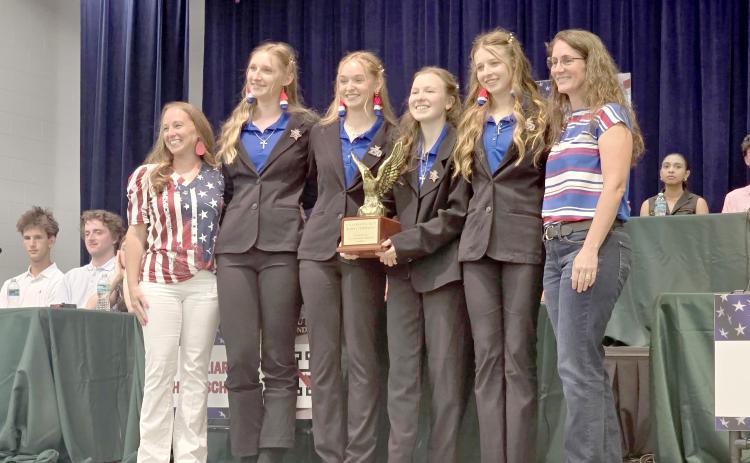 Lily Zettler, Lainey Walters, Amelia Hawkes and Eden Hawkes celebrate the Homeschool team’s victory April 16 at Wildlight Elementary. Submitted