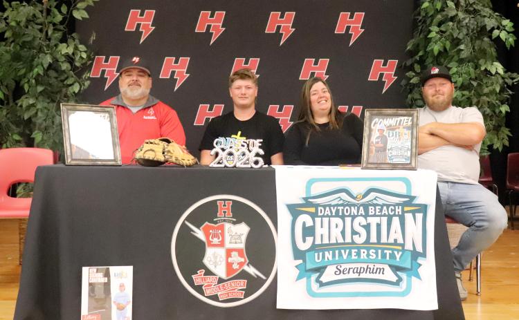 Hilliard Middle-Senior High School senior Anthony “Bubba” Musgrove is joined by mom Heather Weinberg, Corey Stone, and Coach Larry West as he signs with Daytona Beach Christian University April 28. Musgrove is a member of the Hilliard varsity baseball team and will continue to play at DBCU. Photo by Anna Newhoff