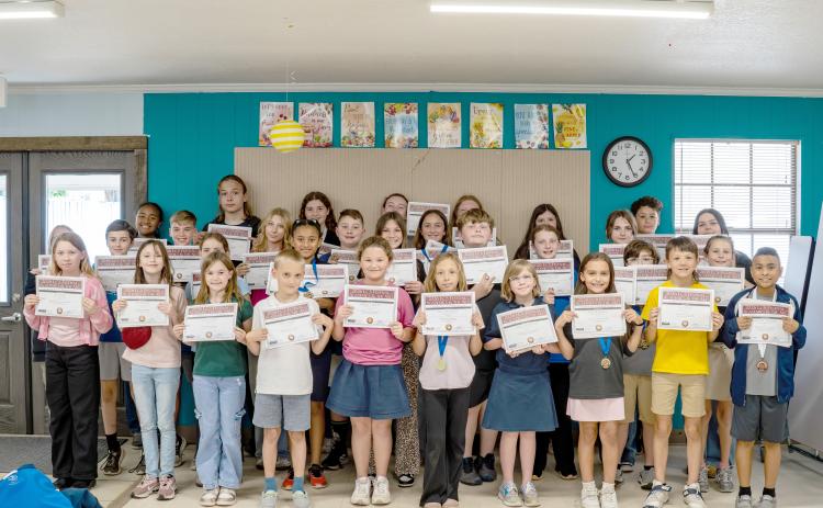 Sonshine Christian Academy third through 12th grade students display certificates from their performances at the League of Christian Schools’ Arts Festival held in Lakeland.