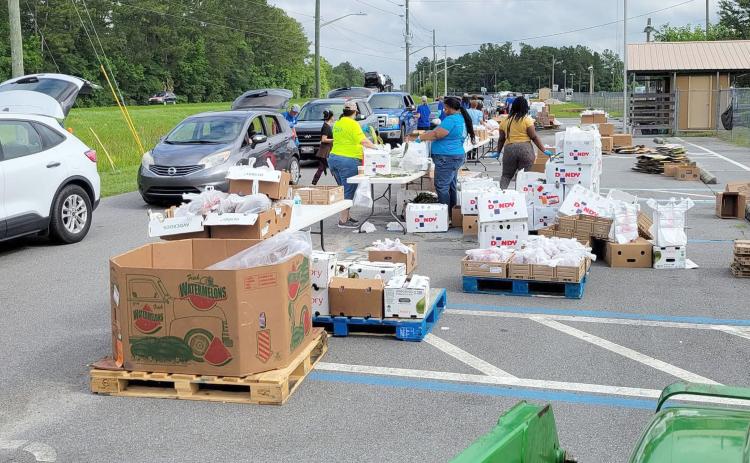 Barnabas Center currently offers drive-thru food drives at the Northeast Florida Fairgrounds while fundraising to build a western Nassau facility. Once complete, distributions could occur at the new building. Submitted