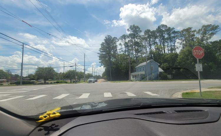 The former caution light at Mickler Street and U.S. 301 in Callahan is gone. It was removed June 17 after it was damaged. It previously aided motorists coming from the west, alerting them that they were entering a small town with reduced speeds and cross traffic. Photo by Amanda Bishop