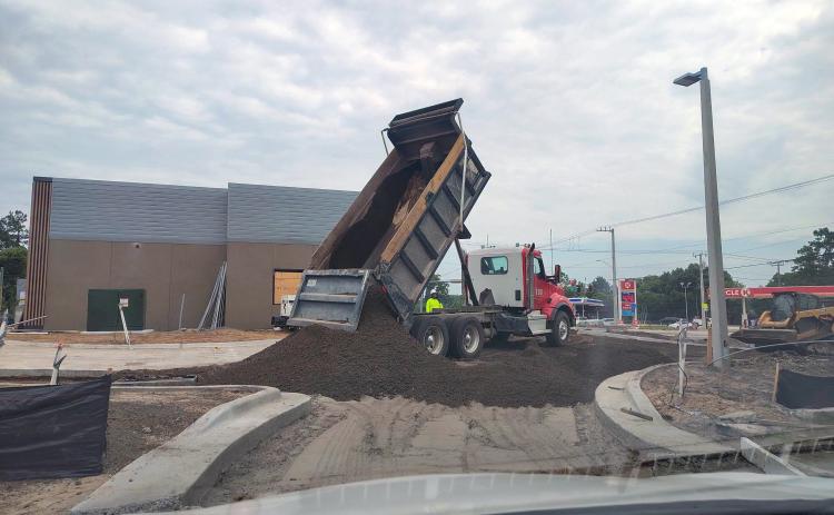 A truckload of dirt is delivered to shape the parking lot at Hilliard’s new McDonald’s. Triple B Dirt LLC hauled 65 loads of dirt then topped it with 40 loads of crushcrete road base to help form the parking lot. Photo courtesy of Triple B Dirt, LLC