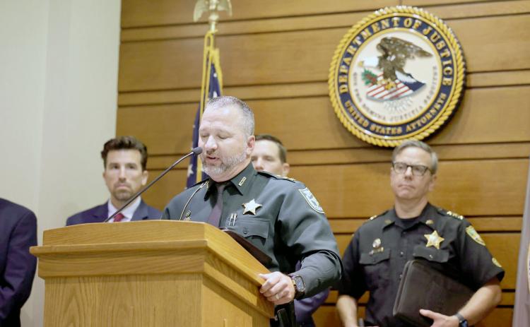 Nassau County Sheriff’s Office Undersheriff Jon Hooper addresses 13 alleged gang members arrested at a Department of Justice press conference in Jacksonville. Submitted