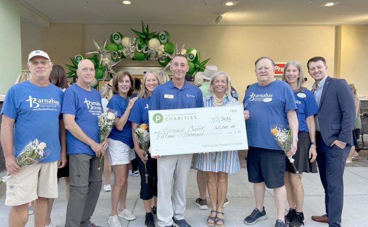 Barnabas Center accepts a $15,000 donation from Publix Super Markets Charities in celebration of the grand opening of the new Fernandina Beach store. Submitted