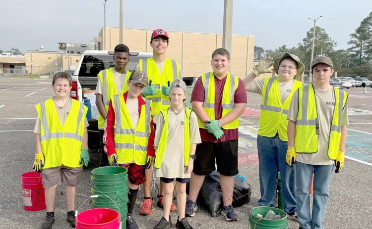 Callahan Boy Scout Troop 351 braves the heat  Saturday to keep Callahan’s Warrior Drive and Brown Street litter free. The troop is an Adopt-a-Highway partner for Keep Nassau Beautiful, Inc. Submitted