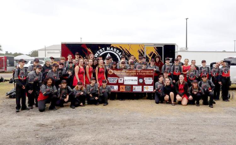 Battling rain and high winds, the West Nassau Warrior Band and West Nassau Warrior Color Guard rank overall superior with the Florida Bandmasters Association.